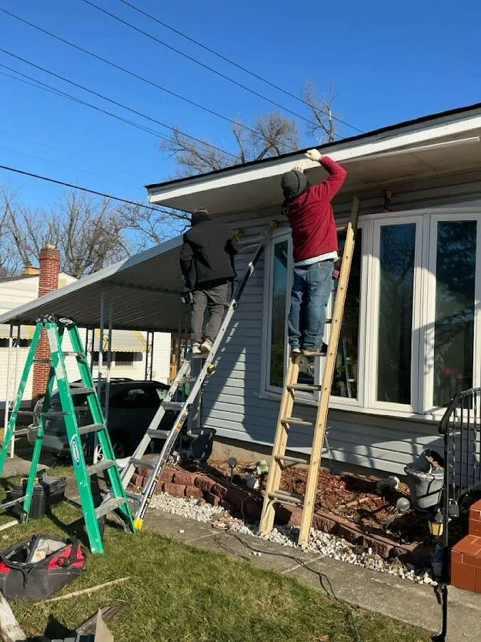 Restoration crew performing exterior repair in Lorain